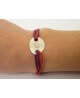 Les Empreintes : bracelet mini galet en or sur cordon